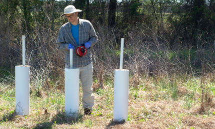 Measuring well depth in riparian buffer, North Carolina.