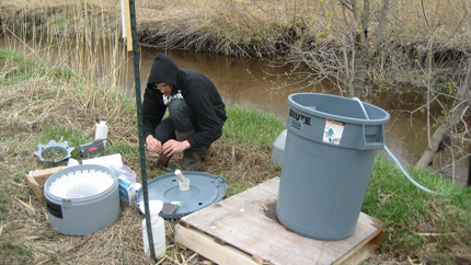 Preparing water samples after a rainfall.