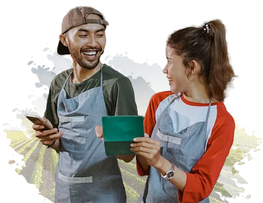 Man and woman in overalls smiling