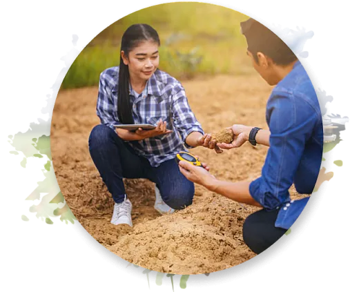 Man and woman examining soil